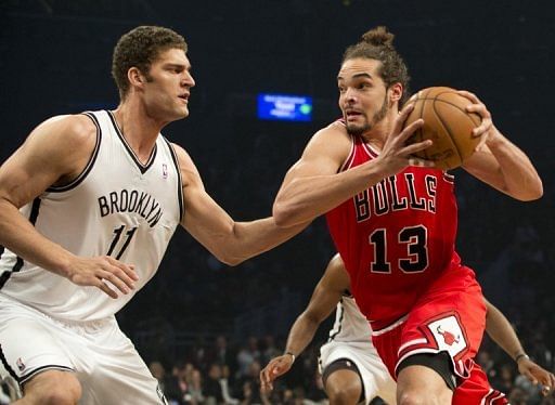 Brooklyn Nets&#039; Brook Lopez (L) tries to block Chicago Bulls&#039; Joakim Noah during their NBA playoff game on April 29, 2013