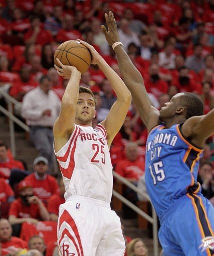 Chandler Parsons of the Houston Rockets shoots over Oklahoma City Thunder's Reggie Jackson on April 29, 2013