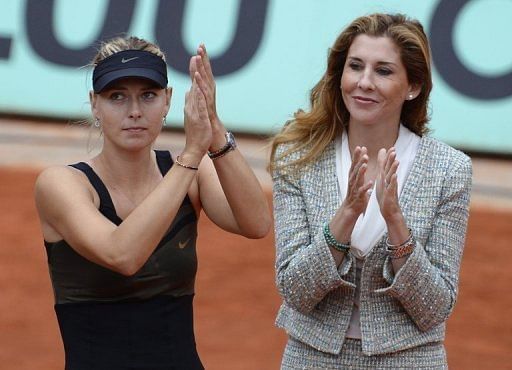Maria Sharapova and Monica Seles on the podium after the French Open final on June 9, 2012