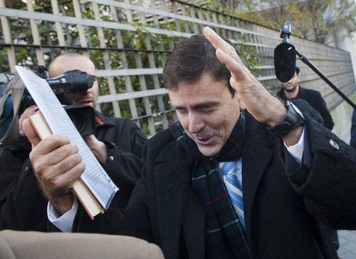 Spanish doctor Eufemiano Fuentes arrives at the Madrid courthouse for the start of his trial on January 28, 2013