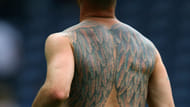 #11 football team of tattooed players