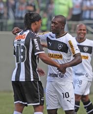 Ronaldinho of Atletico MG greets Eedorf of Botafogo during a match between Botafogo and Atletico MG as part ot the Brazilian Championship at Independence Stadium on August 19, 2012 in Belo Horizonte, Brazil. (Photo by Celio Messias/LatinContent/Getty Images)