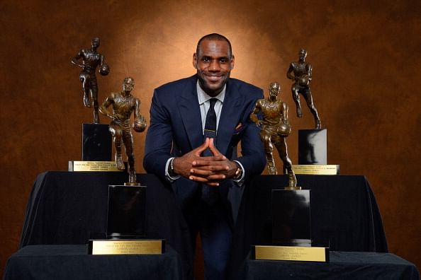 Lebron James with multiple Maurice Podoloff Trophies