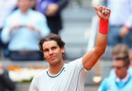 Rafael Nadal celebrates after winning his men's singles third round tennis match against Russian player Mikhail Youzhny at the Madrid Masters at the Magic Box (Caja Magica) sports complex in Madrid on May 9, 2013. Nadal won the match 6-2, 6-3. AFP PHOTO / PIERRE-PHILIPPE MARCOU (Photo credit should read PIERRE-PHILIPPE MARCOU/AFP/Getty Images)