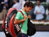 Federer trudges off after his match against Nishikori on day six of the Mutua Madrid Open at the Caja Magica on May 9, 2013 in Madrid, Spain. (Getty Images)