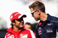 Sebastian Vettel (R) of Germany and Infiniti Red Bull Racing talks with Felipe Massa of Brazil and Ferrari in the paddock following practice for the Spanish Formula One Grand Prix at the Circuit de Catalunya on May 10, 2013 in Montmelo, Spain. (Photo by Mark Thompson/Getty Images)