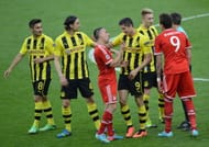 Bayern Munich's French midfielder Franck Ribery (3rd L) gestures to Borussia Dortmund's Polish striker Robert Lewandowski