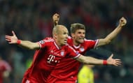 rjen Robben of Bayern Muenchen celebrates with team-mate Thomas Mueller after scoring a goal during the UEFA Champions League final match between Borussia Dortmund and FC Bayern Muenchen at Wembley Stadium on May 25, 2013 in London, United Kingdom. (Photo by Alex Livesey/Getty Images)