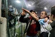 Picture dated 06 January 2005 of Lazio's forward Paolo Di Canio gesturing towards Lazio fans at the end of Lazio vs AS Roma Serie A football match at Rome's Olympic stadium. Di Canio is to face a disciplinary hearing over his fascist salute allegedly made by the veteran striker in last week end match against Livorno, the Italian football federation (FIGC) said 13 December 2005. AFP PHOTO/Paolo COCCO (Photo credit should read PAOLO COCCO/AFP/Getty Images)