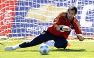 Spanish goalkeeper Diego Lopez stops a b