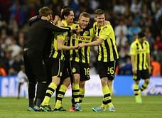 Dortmund hold on despite late Real rally