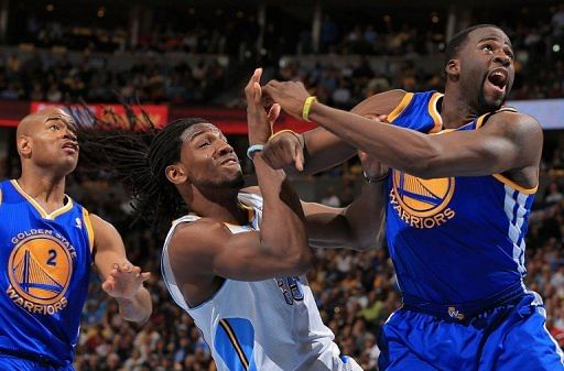 Draymond Green (R) is called for a foul as he collides with Kenneth Faried on April 30, 2013