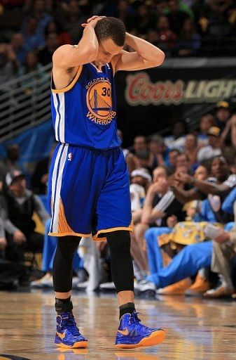 Stephen Curry of the Golden State Warriors walks to the bench against the Denver Nuggets on April 30, 2013
