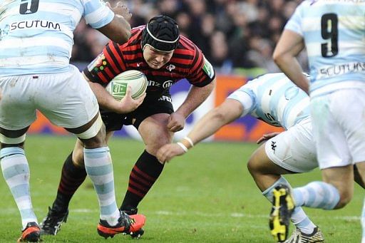 Saracens&#039;s prop Matt Stevens (C) charges the Racing Metro line during their European Cup match on January 12, 2013