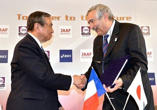 Japanese and French athletics federations chiefs sign a partnership agreement in Tokyo, on May 1, 2013