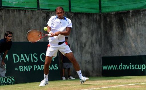 Aqeel Khan of Pakistan plays Artem Sitak of New Zealand in their Davis Cup match in Yangon on April 5, 2013