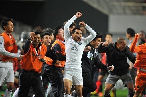 Buriram United celebrate as they became the first Thai team to reach the AFC Champions League last 16, May 1, 2013