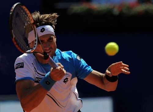 Spanish player David Ferrer returns a ball in Barcelona on April 24, 2013