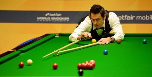 Ronnie O&#039;Sullivan of England plays a shot in the World Snooker Championships in Sheffield, England, on April 30, 2013