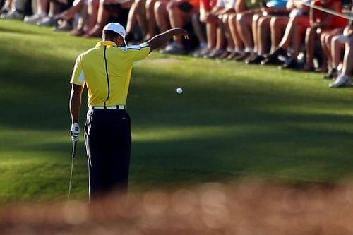 Tiger Woods drops his ball on the 15th hole during the second round of the Augusta National on April 12, 2013