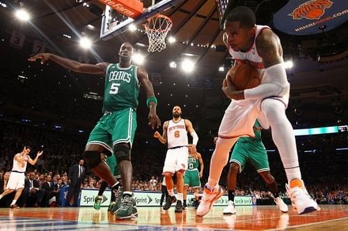 The New York Knicks' J.R. Smith (R) is fouled by Kevin Garnett of the Boston Celtics during their game on May 1, 2013