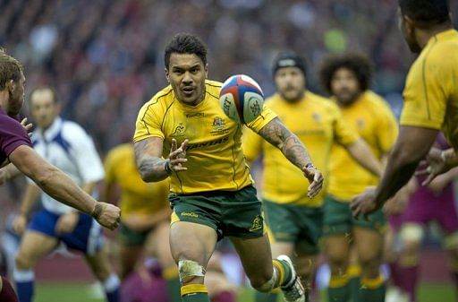 Australia wing Digby Ioane runs with the ball during a match at Twickenham Stadium in London, November 17, 2012