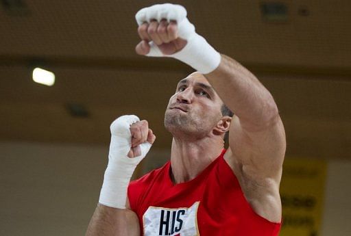 World heavyweight champion Wladimir Klitschko warms up for a public training session on May 1, 2013