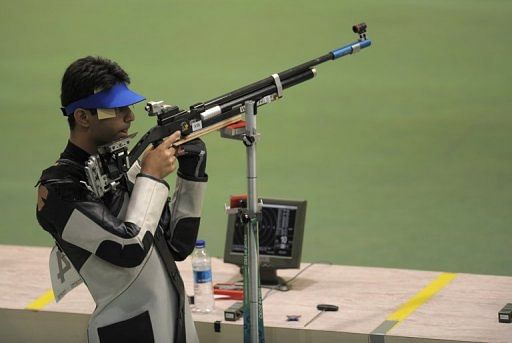 Abhinav Bindra prepares to aim during the XIX Commonwealth Games in New Delhi on October 6, 2010