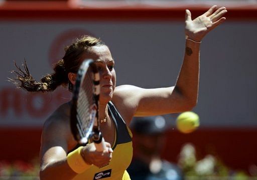 Anastasia Pavlyuchenkova returns the ball to Romina Oprandi during the Portugal Open in Oeiras on May 3, 2013