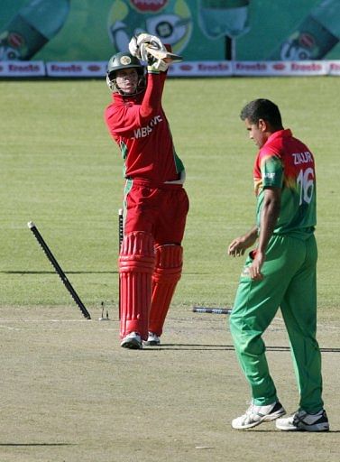 Zimbabwean batsman Malcolm Waller loses his wicket to Ziaur Rahman in Bulawayo, Zimbabwe on May 3, 2013