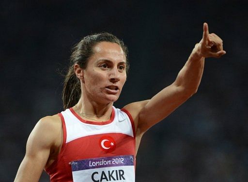Turkey&#039;s Asli Cakir Alptekin celebrates after winning the women&#039;s 1500m at the London Olympic Games, August 10, 2012