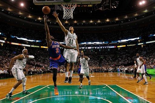 Courtney Lee #11 of the  Celtics tries to block a shot by Raymond Felton #2 of the Knicks, May 3, 2013 in Boston