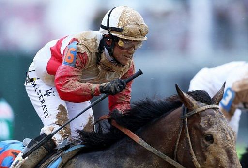 Joel Rosario atop Orb reacts after winning the 139th running of the Kentucky Derby at Churchill Downs on May 4, 2013