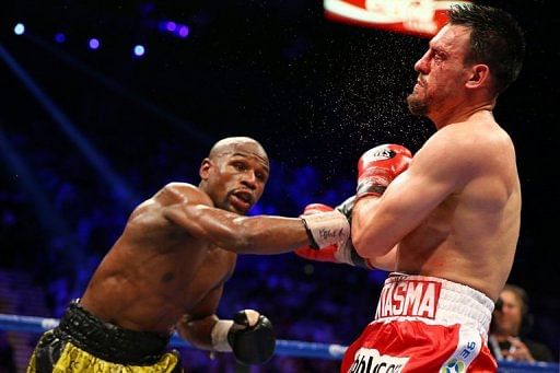 Floyd Mayweather throws a right to the face of Robert Guerrero in their WBC welterweight title bout on May 4, 2013