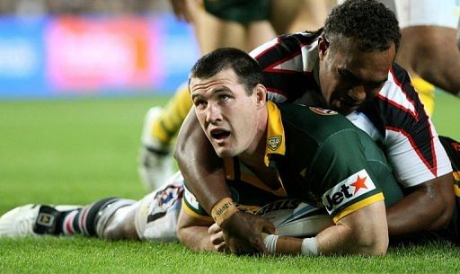 Australia&#039;s Paul Gallen scores the first try against Fiji during the Rugby League World Cup in Sydney, November 16, 2008