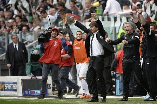 Juventus&#039; coach Antonio Conte celebrates on May 5, 2013 at the Alps stadium in Turin