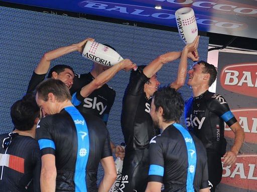 Cyclists of Team Sky celebrate on the podium on May 5, 2013 in Forio