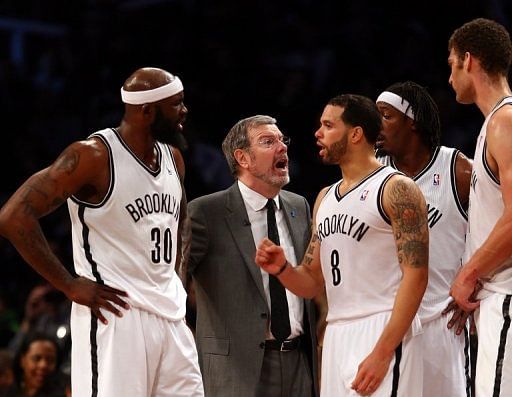 Head coach P.J. Carlesimo of the Brooklyn Nets talks with players on May 4, 2013 at the Barclays Center in Brooklyn