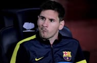 Barcelona's Lionel Messi grimaces as he sits on the bench at the Camp Nou stadium in Barcelona on May 5, 2013