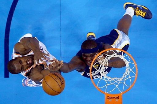 Serge Ibaka (L) of the Thunder jumps for a rebound against Zach Randolph of the Grizzlies on May 5, 2013 in Oklahoma