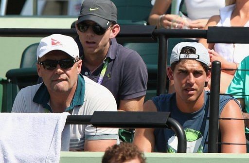 John Tomic, father of Bernard Tomic, watches as his son plays against Andy Murray at the Miami Masters on March 23, 2013