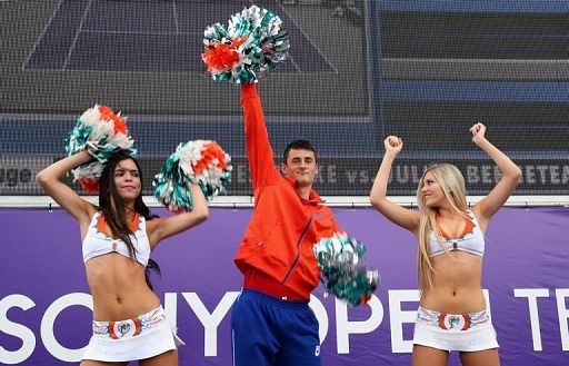 Bernard Tomic dances with cheerleaders during the Sony Open in Key Biscayne, Florida on March 22, 2013