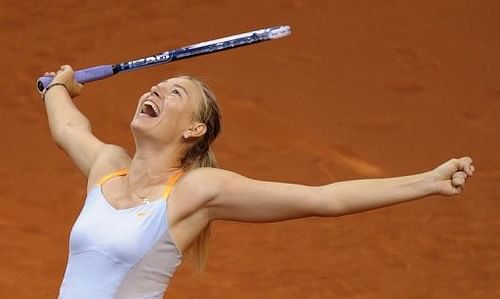 Maria Sharapova celebrates victory in the Porsche Tennis Grand Prix in Stuttgart on April 28, 2013