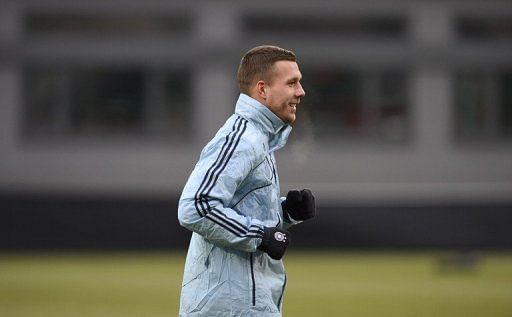 Lukas Podolski attends a training in the stadium in Fuerth, southern Germany, on March 25, 2013
