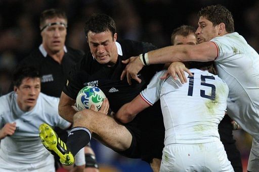All Blacks centre Richard Kahui is tackled during a Rugby World Cup match in Auckland on October 23, 2011