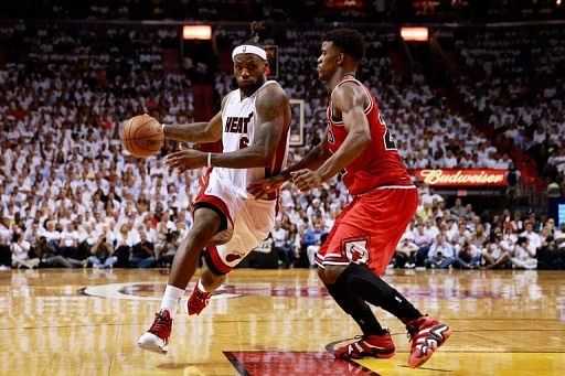 LeBron James #6 of the Miami Heat drives against Jimmy Butler of the Chicago Bulls May 6, 2013 in Miami, Florida
