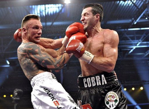 Mikkel Kessler (left) clashes with Carl Froch during their super-middleweight fight in Herning, on April 24, 2010