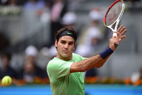 Roger Federer returns the ball to Radek Stepanek (not in picture) during their match at the Madrid Open on May 7, 2013