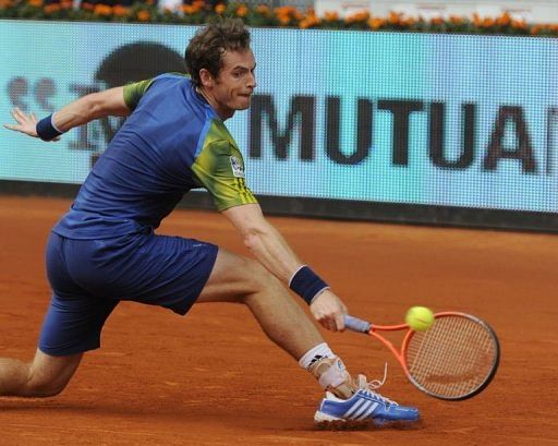 Andy Murray returns the ball to Florian Mayer in Madrid on May 7, 2013