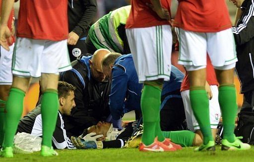 Swansea&#039;s goalkeeper Michel Vorm recieves treatment on May 7, 2013